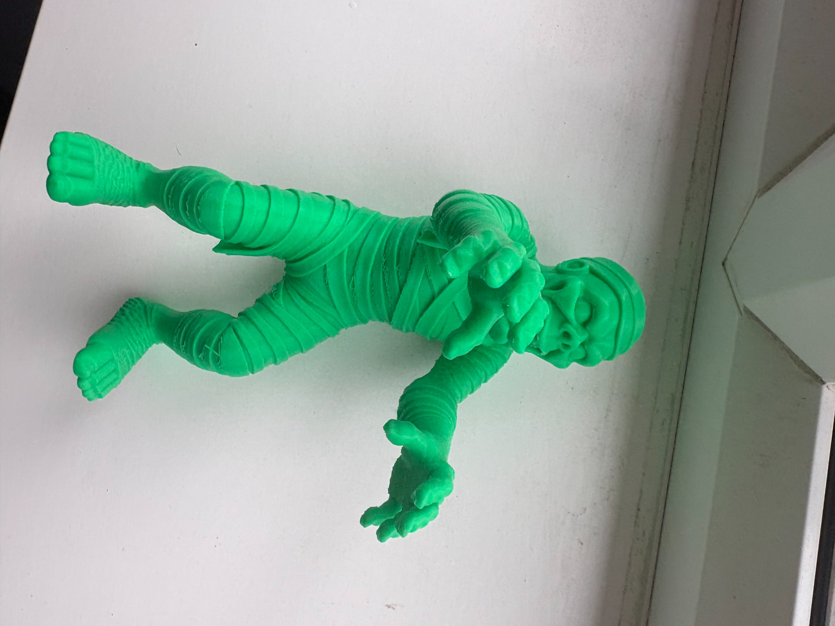 Green 3D printed mummy figure